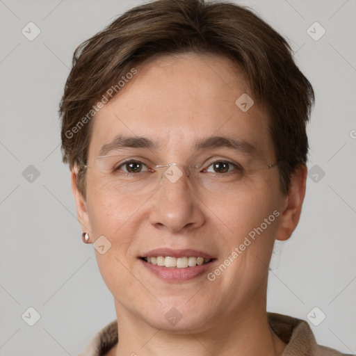 Joyful white adult female with short  brown hair and grey eyes