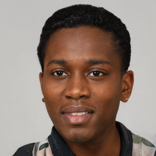 Joyful black young-adult male with short  black hair and brown eyes