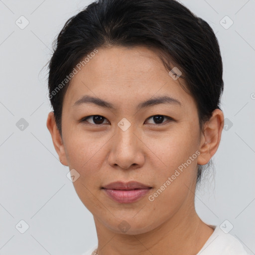 Joyful asian young-adult female with short  brown hair and brown eyes