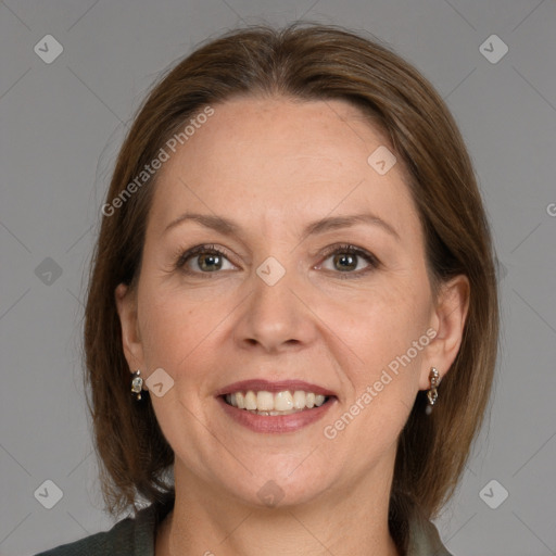 Joyful white adult female with medium  brown hair and grey eyes