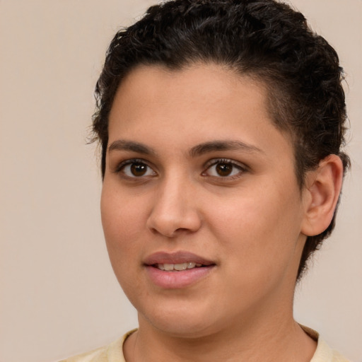 Joyful white young-adult female with short  brown hair and brown eyes