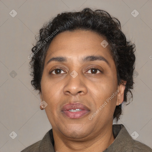 Joyful black adult female with short  brown hair and brown eyes