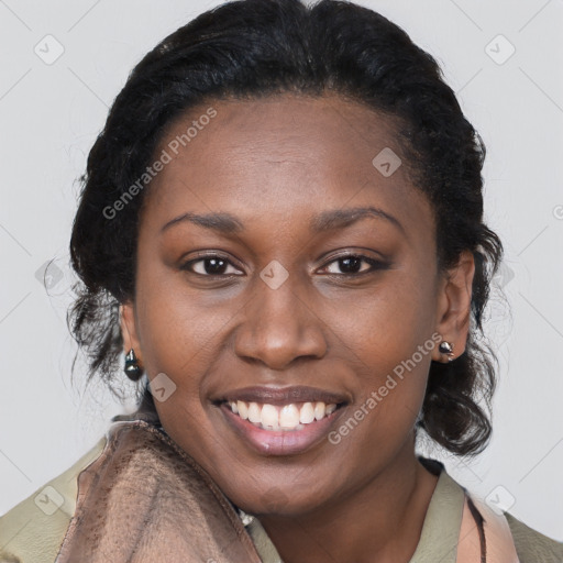 Joyful black young-adult female with long  brown hair and brown eyes