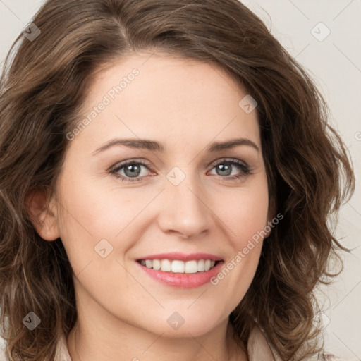 Joyful white young-adult female with long  brown hair and green eyes