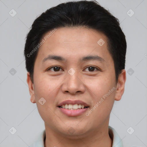 Joyful asian young-adult male with short  brown hair and brown eyes