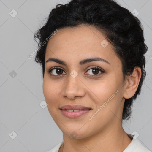 Joyful latino young-adult female with medium  black hair and brown eyes