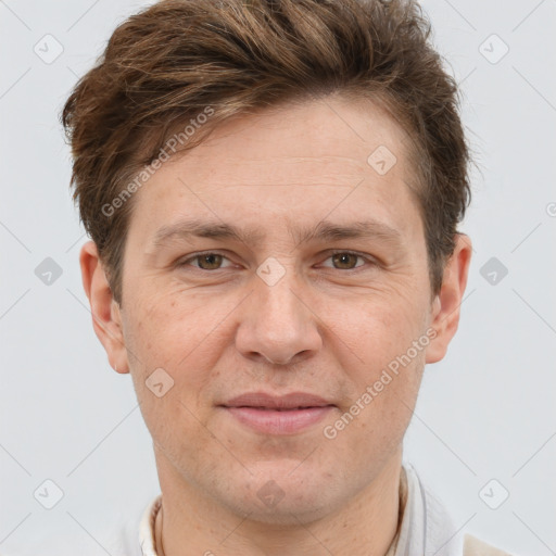 Joyful white adult male with short  brown hair and brown eyes