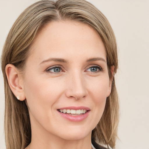 Joyful white young-adult female with medium  brown hair and blue eyes