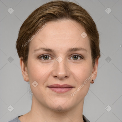 Joyful white young-adult female with short  brown hair and grey eyes