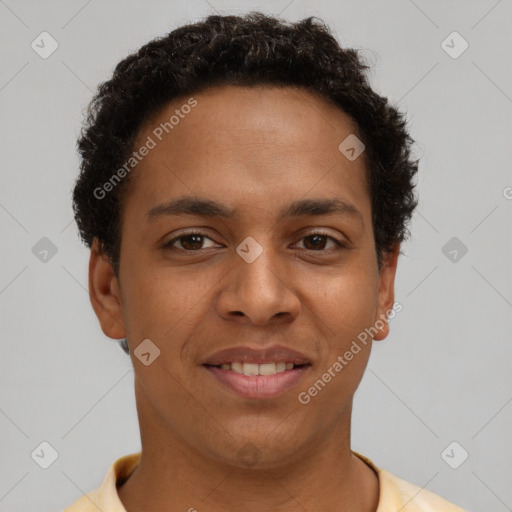 Joyful black young-adult male with short  brown hair and brown eyes