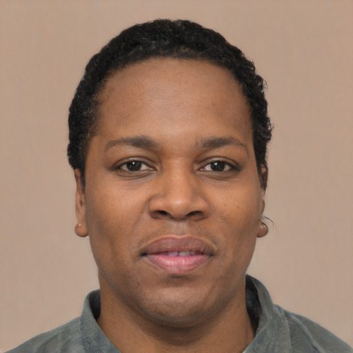 Joyful latino adult male with short  black hair and brown eyes