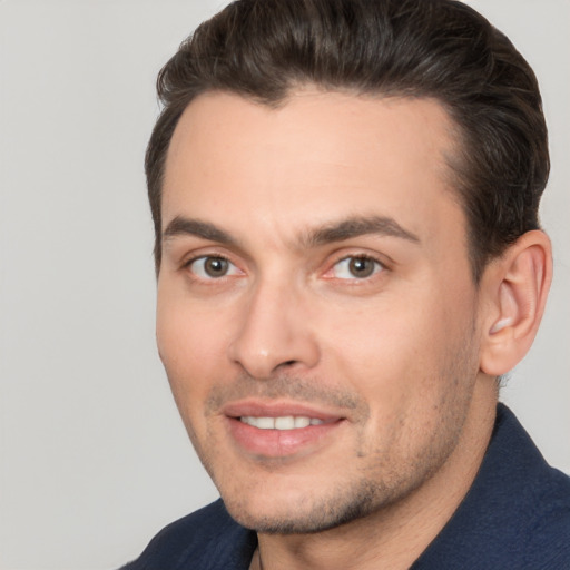 Joyful white young-adult male with short  brown hair and brown eyes