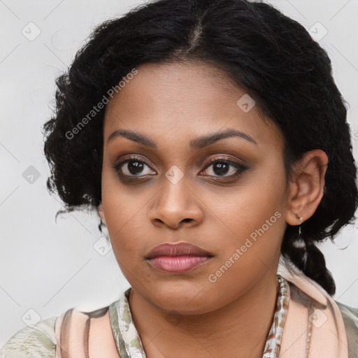 Joyful black young-adult female with long  brown hair and brown eyes