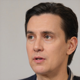 Neutral white adult male with short  black hair and brown eyes