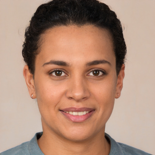 Joyful white young-adult female with short  brown hair and brown eyes