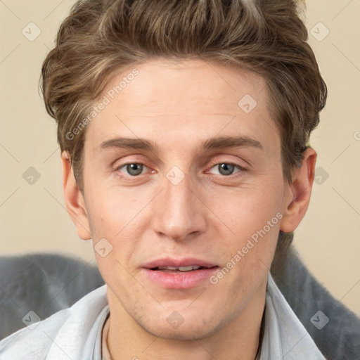 Joyful white adult male with short  brown hair and grey eyes