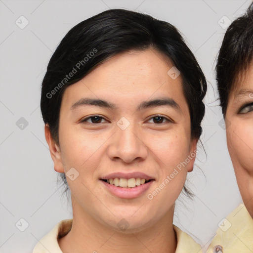 Joyful asian young-adult female with medium  brown hair and brown eyes