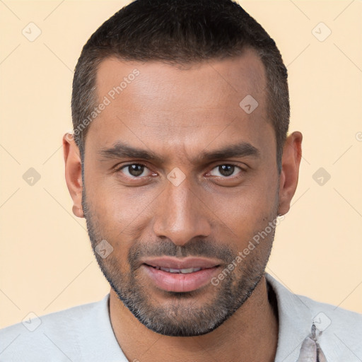 Joyful white young-adult male with short  black hair and brown eyes