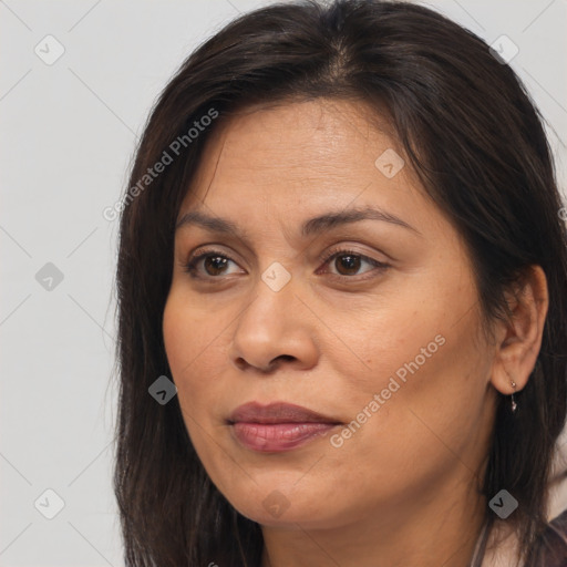 Joyful white adult female with long  brown hair and brown eyes