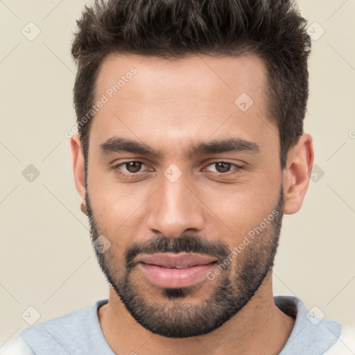 Joyful white young-adult male with short  brown hair and brown eyes