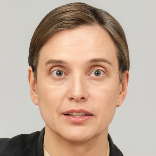 Joyful white adult male with short  brown hair and grey eyes