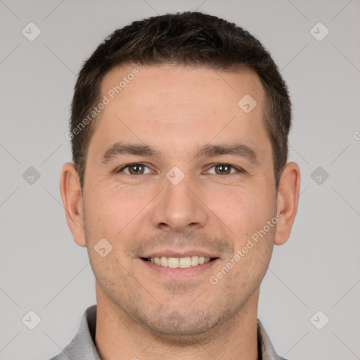 Joyful white young-adult male with short  brown hair and brown eyes