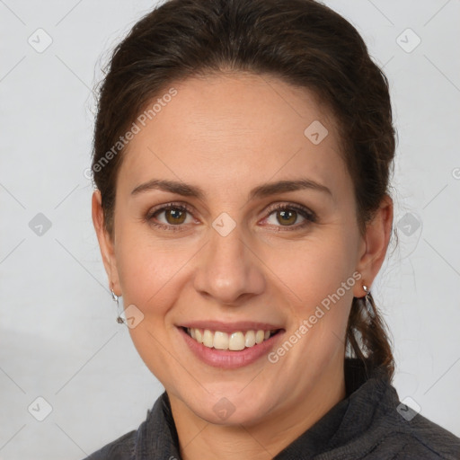 Joyful white adult female with short  brown hair and brown eyes