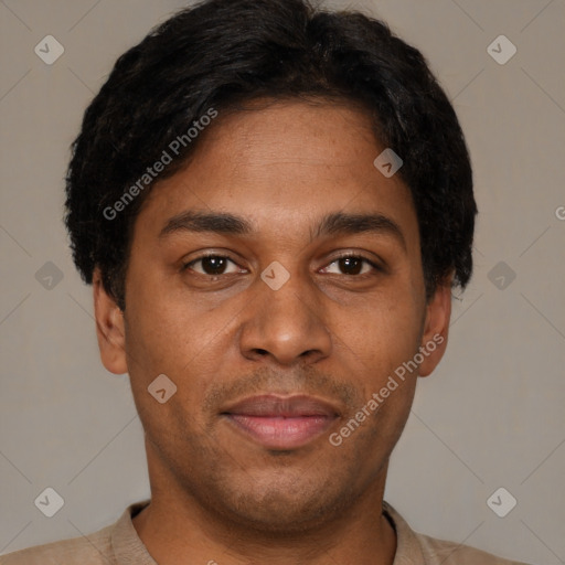 Joyful latino young-adult male with short  brown hair and brown eyes