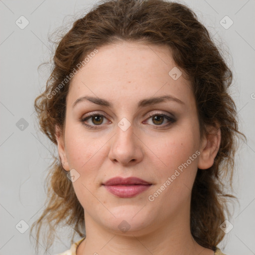 Joyful white young-adult female with medium  brown hair and green eyes