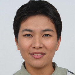 Joyful asian young-adult female with short  brown hair and brown eyes