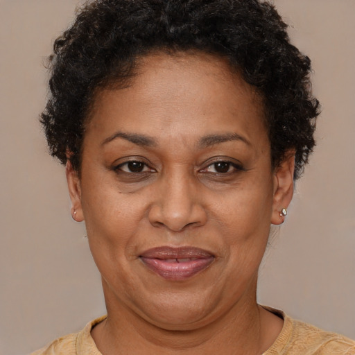 Joyful latino adult female with short  brown hair and brown eyes