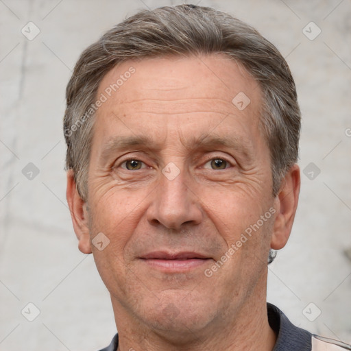 Joyful white middle-aged male with short  brown hair and grey eyes