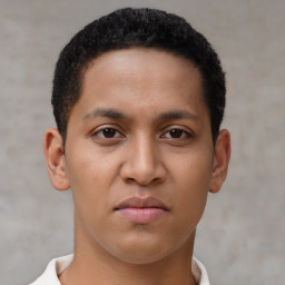 Joyful latino young-adult male with short  brown hair and brown eyes