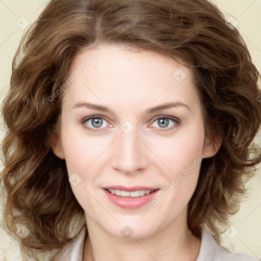 Joyful white young-adult female with medium  brown hair and green eyes