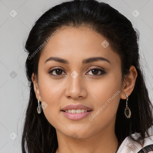 Joyful latino young-adult female with long  brown hair and brown eyes