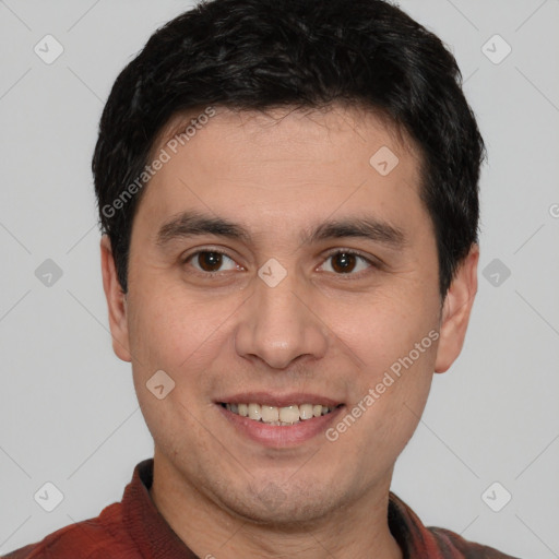 Joyful white young-adult male with short  black hair and brown eyes