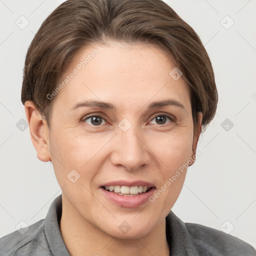 Joyful white adult female with short  brown hair and grey eyes