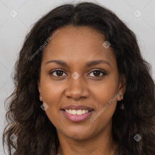 Joyful black young-adult female with long  brown hair and brown eyes