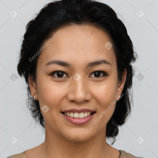 Joyful latino young-adult female with medium  brown hair and brown eyes