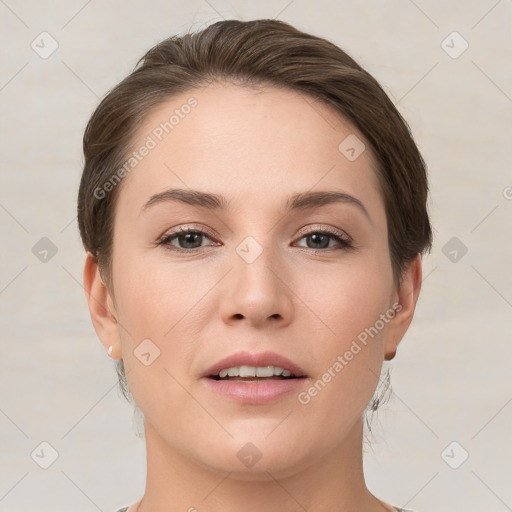 Joyful white young-adult female with short  brown hair and brown eyes