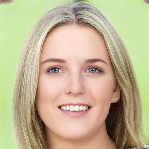 Joyful white young-adult female with long  brown hair and green eyes