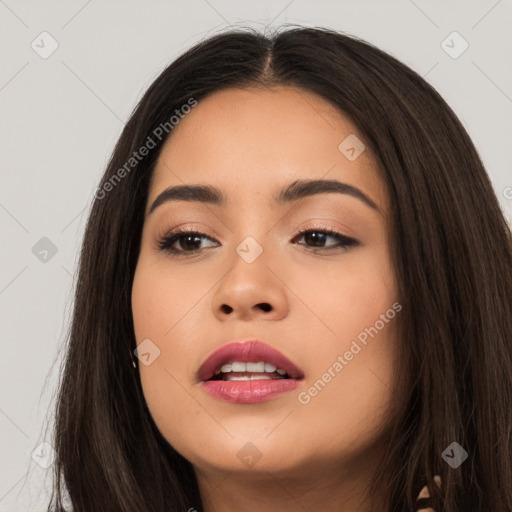 Joyful white young-adult female with long  brown hair and brown eyes