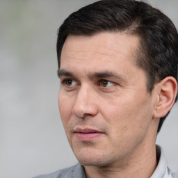 Neutral white adult male with short  black hair and brown eyes