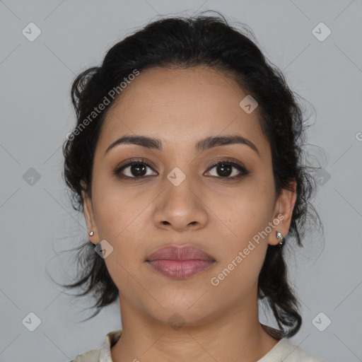 Joyful latino young-adult female with medium  brown hair and brown eyes