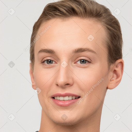 Joyful white young-adult female with short  brown hair and grey eyes