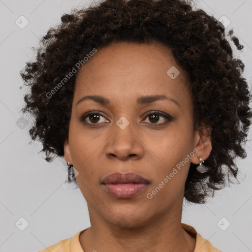 Neutral black young-adult female with medium  brown hair and brown eyes