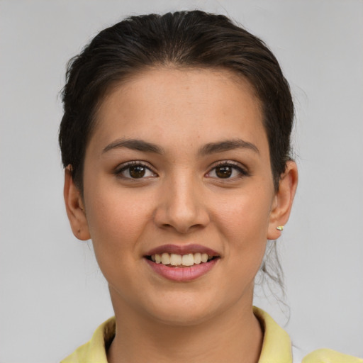 Joyful white young-adult female with short  brown hair and brown eyes