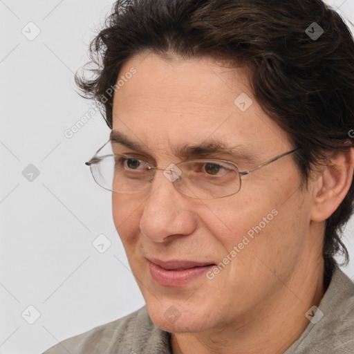 Joyful white adult male with medium  brown hair and brown eyes