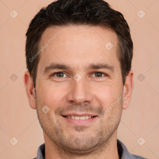 Joyful white adult male with short  brown hair and brown eyes