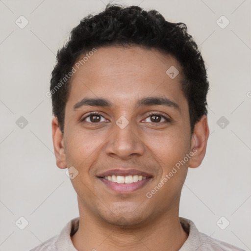 Joyful latino young-adult male with short  brown hair and brown eyes